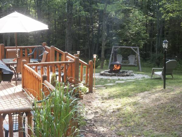 Private wooded seclusion surrounds the many decks.